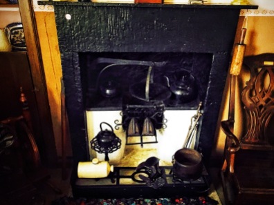Fireplace with cooking utensils